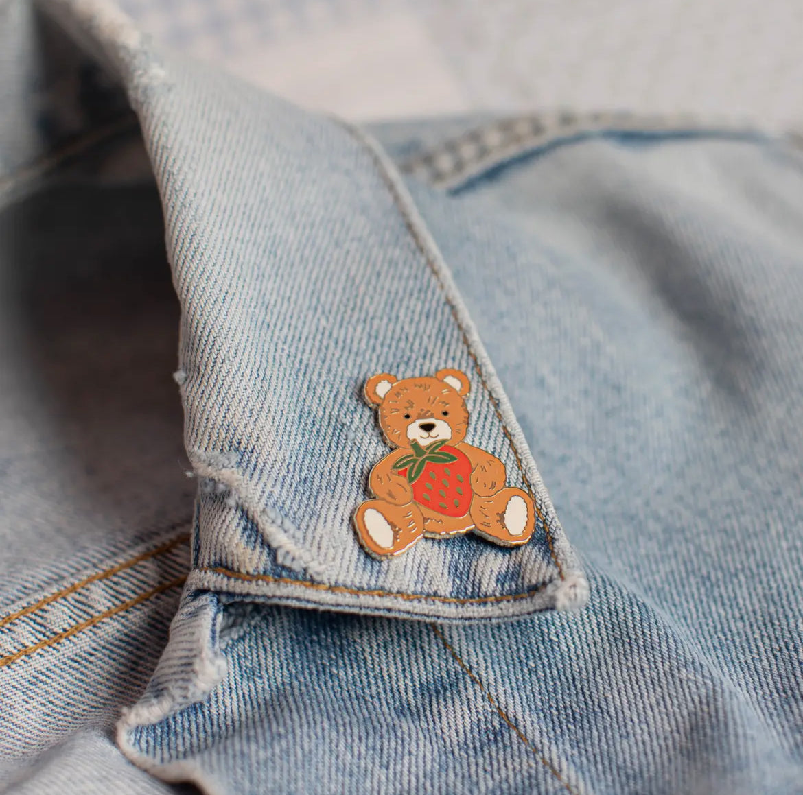 Teddy bear with strawberry pin