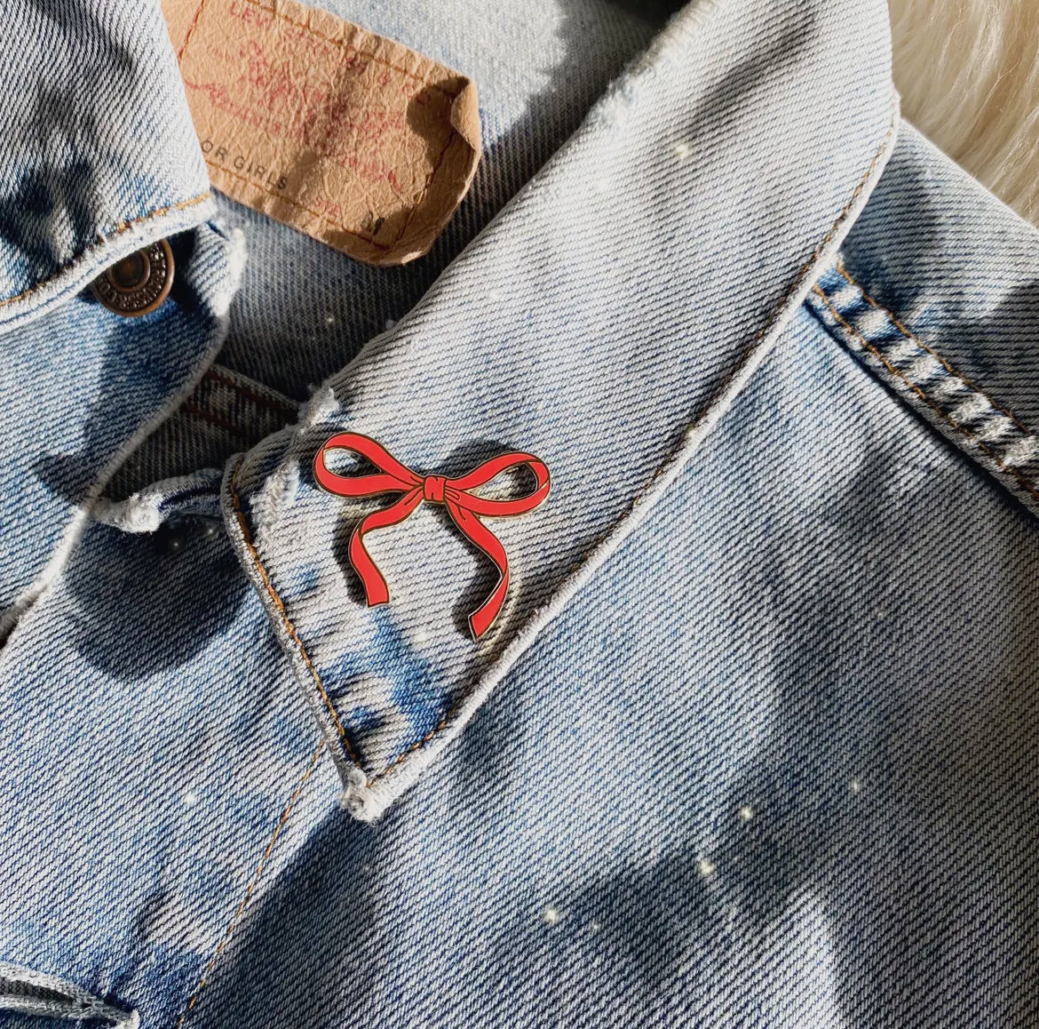 Red bow pin