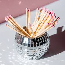 Disco match holder with striker