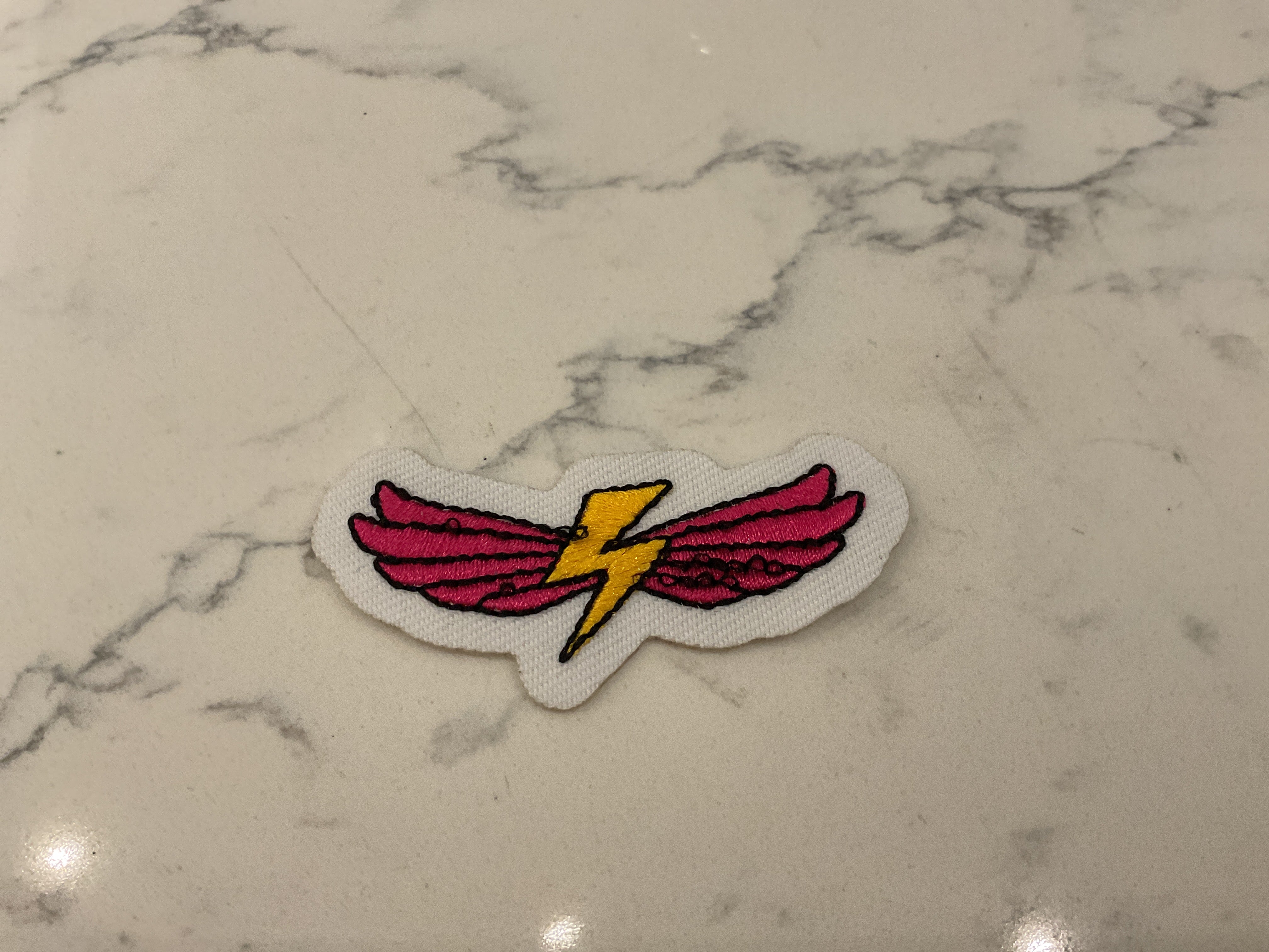 Pink wing with yellow lightening patch