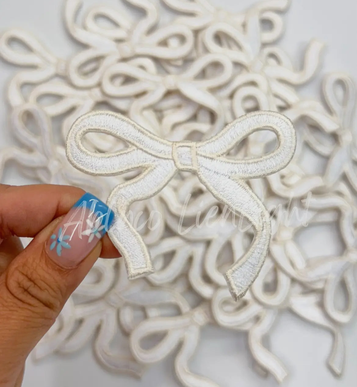 White bow patch