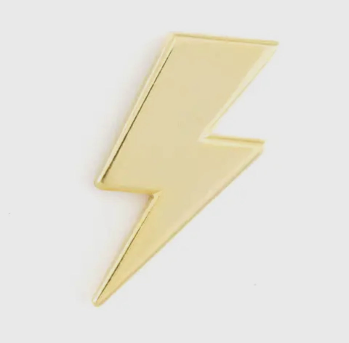 Gold lighting bolt pin