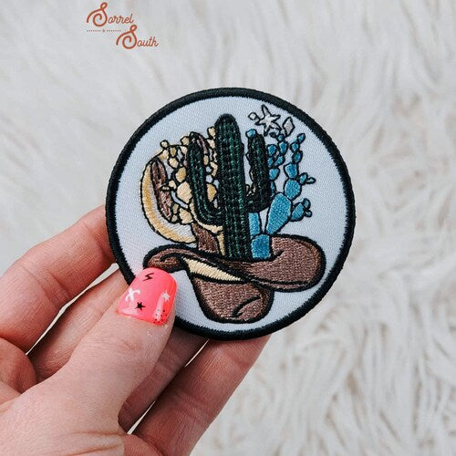 Cactus growing out of cowboy hat patch