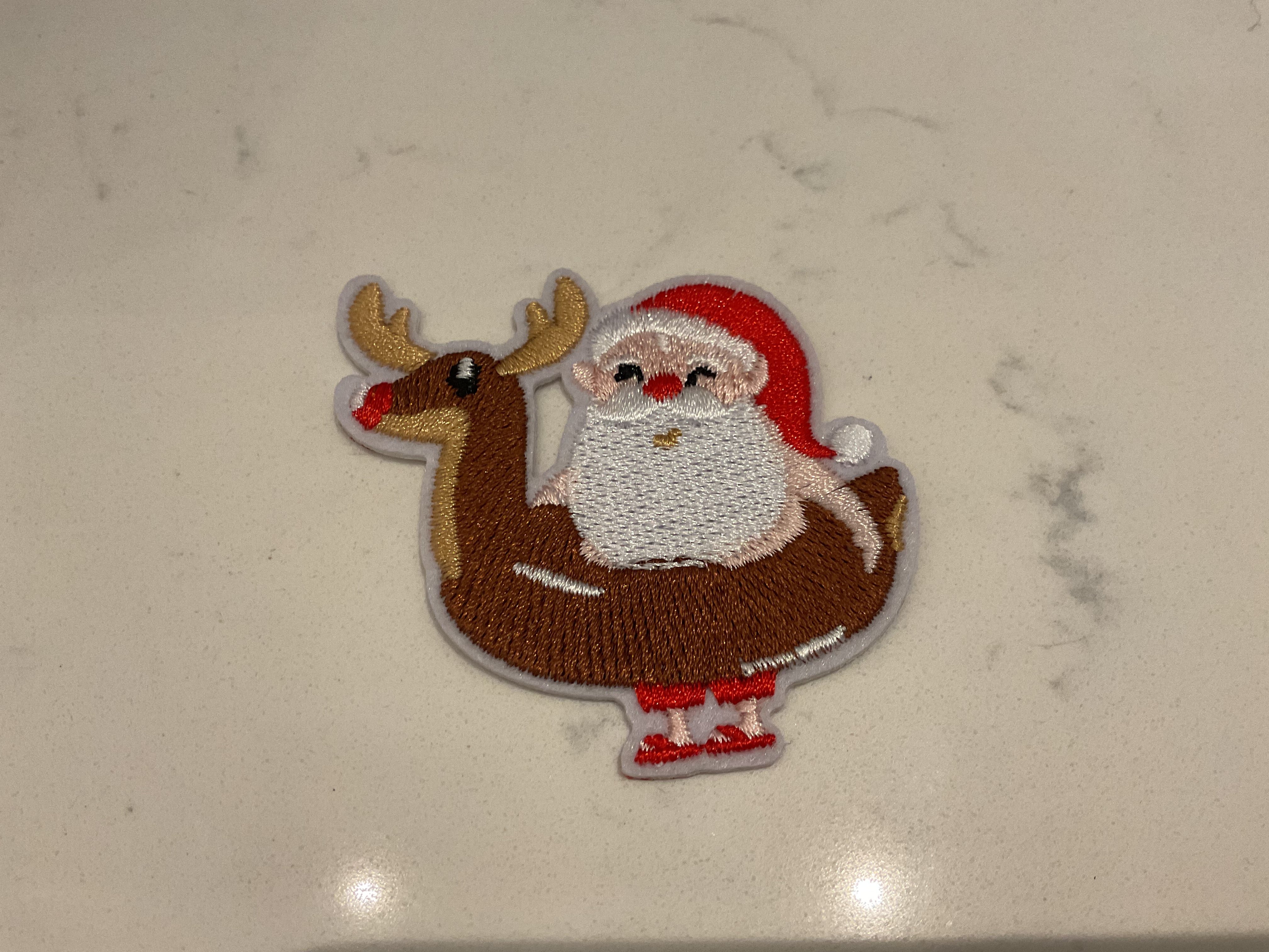 Santa in a reindeer Floaty patch