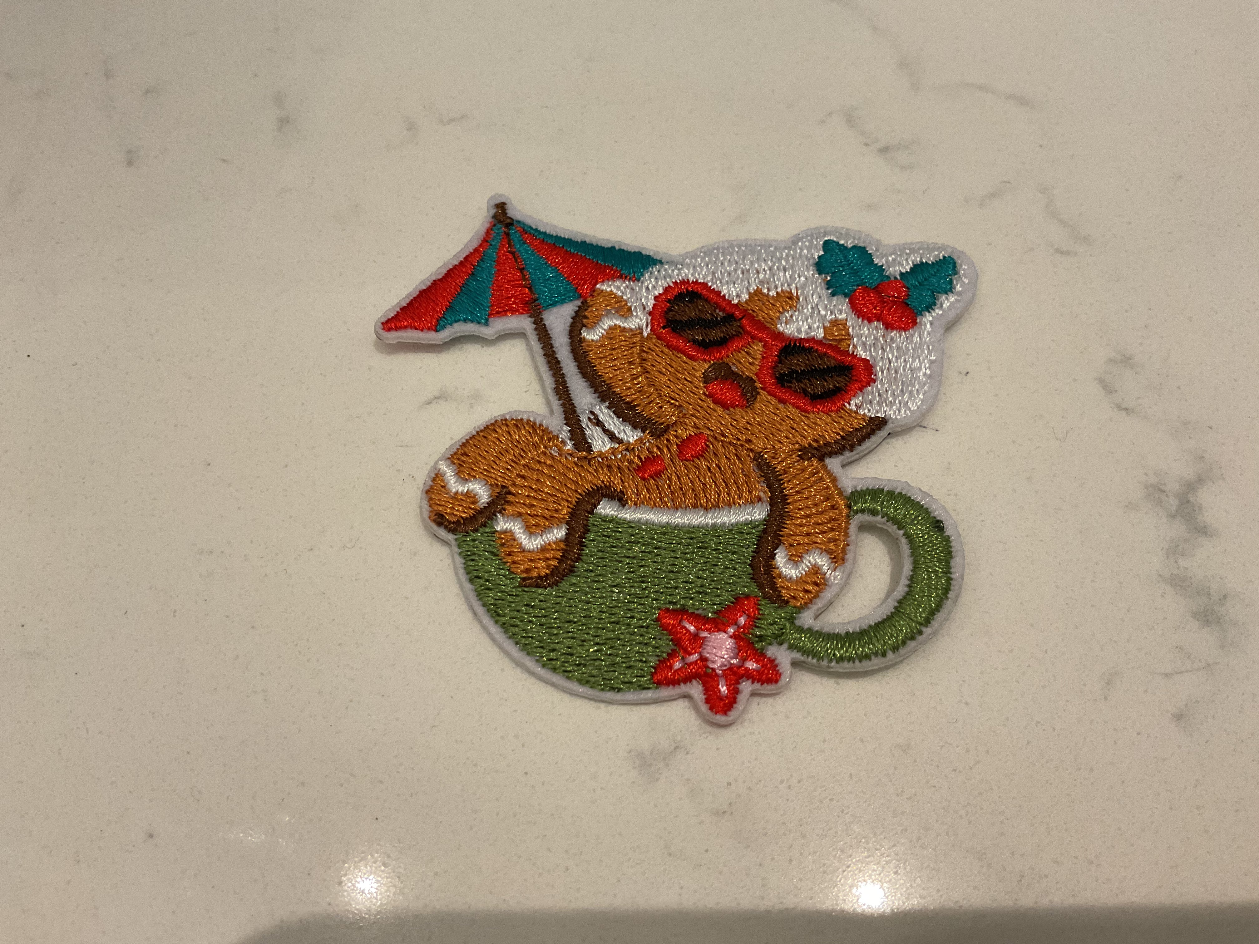 Gingerbread man in a green cup patch
