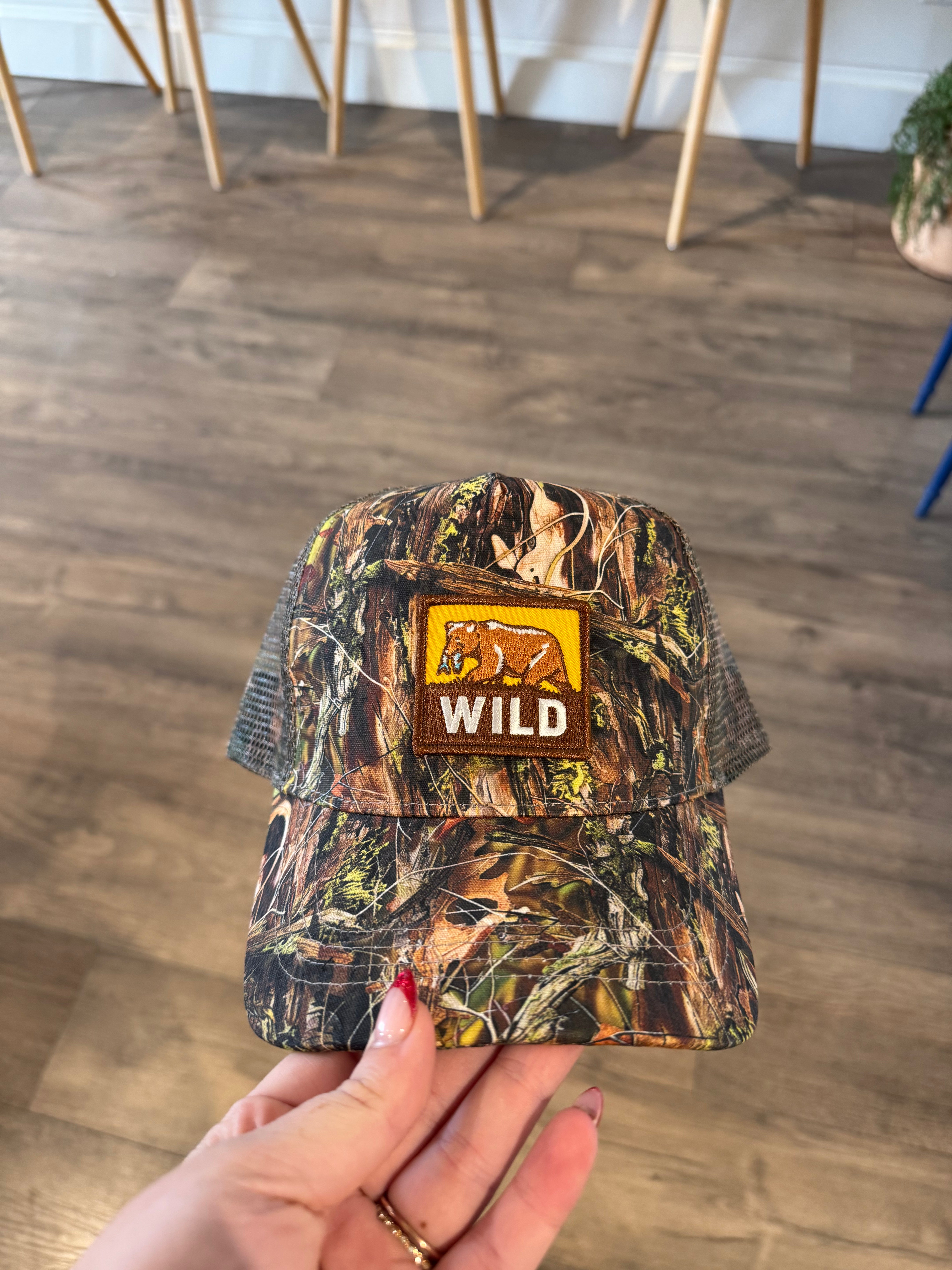 Camo trucker hat with wild patch